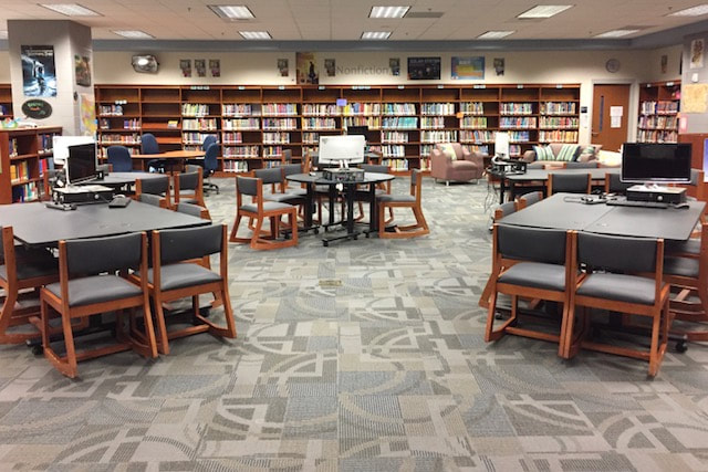Group library tables with one computer at each